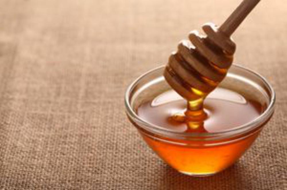 Honey with dipping stick